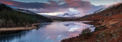 Panoramic landscape photography/Llynau Mymbyr and Snowdon Horseshoe in the background at Winter sunrise in Snowdonia North Wales