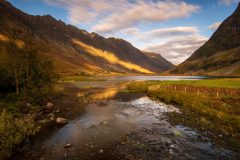 Loch Achtriochtan at autumn sunrise with our canvas prints. Shop unique wall art inspired by the stunning landscapes of the Scottish Highlands.