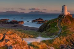 Twr Mawr Lighthouse with vibrant sunset photography