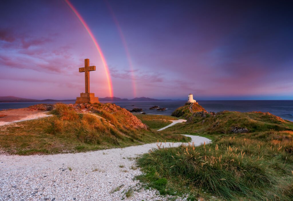 Buy Llanddwyn Island Lighthouse prints—museum-quality Anglesey wall art and rainbow photos.